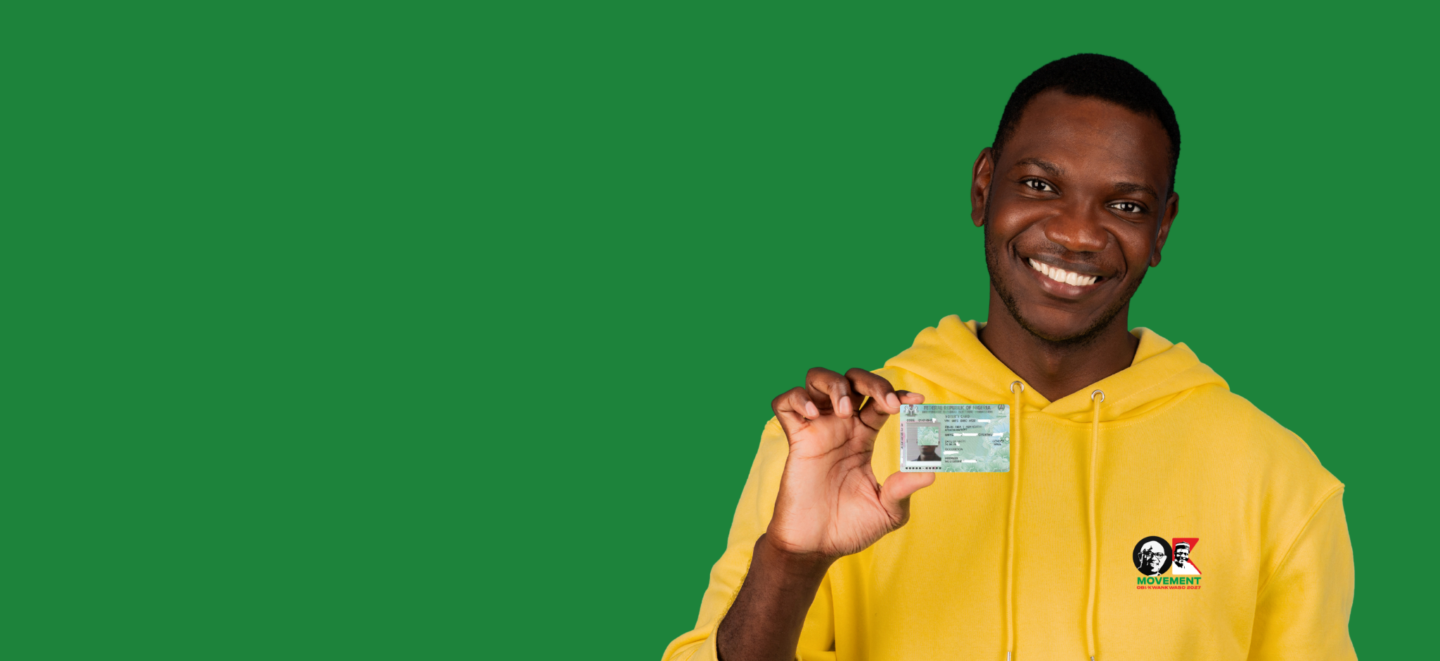 A young Nigerian proudly displaying his Permanent Voter Card