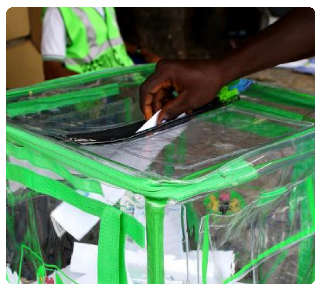 A Nigerian voter posting a ballot paper into a transparent INEC ballot box